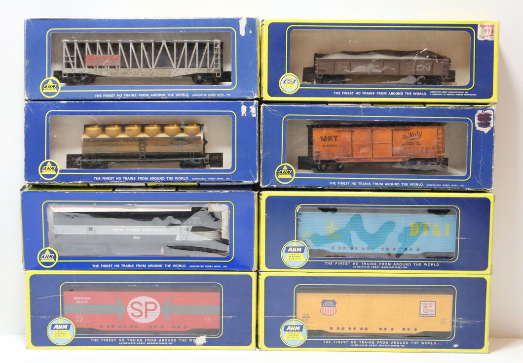 Lot of 8x AHM HO Scale Train Car Collection (Carrier, Box Cars, Dummy Eng, Tank)